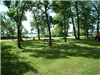 Picnic Table Among the Trees with Water in the Background at Roadside Park