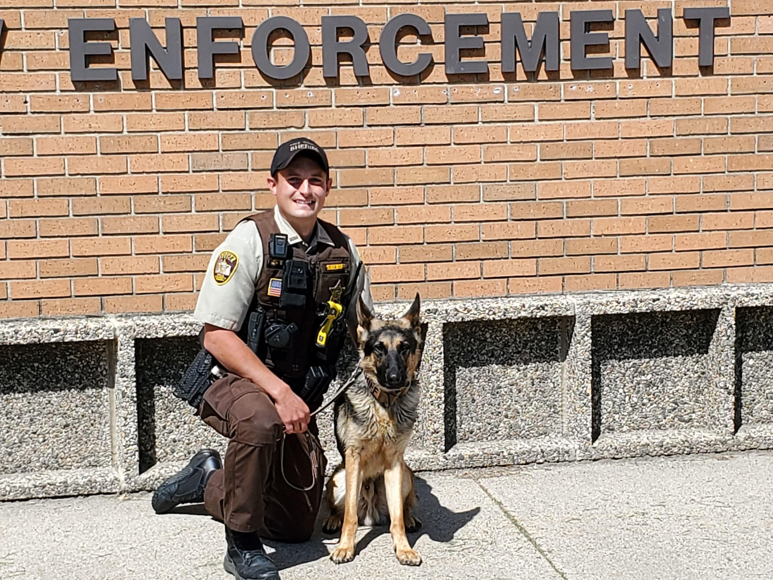 K9 Rex poses with a Polk County Deputy on his first day.