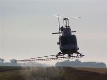 Helicopter Spraying Cattails