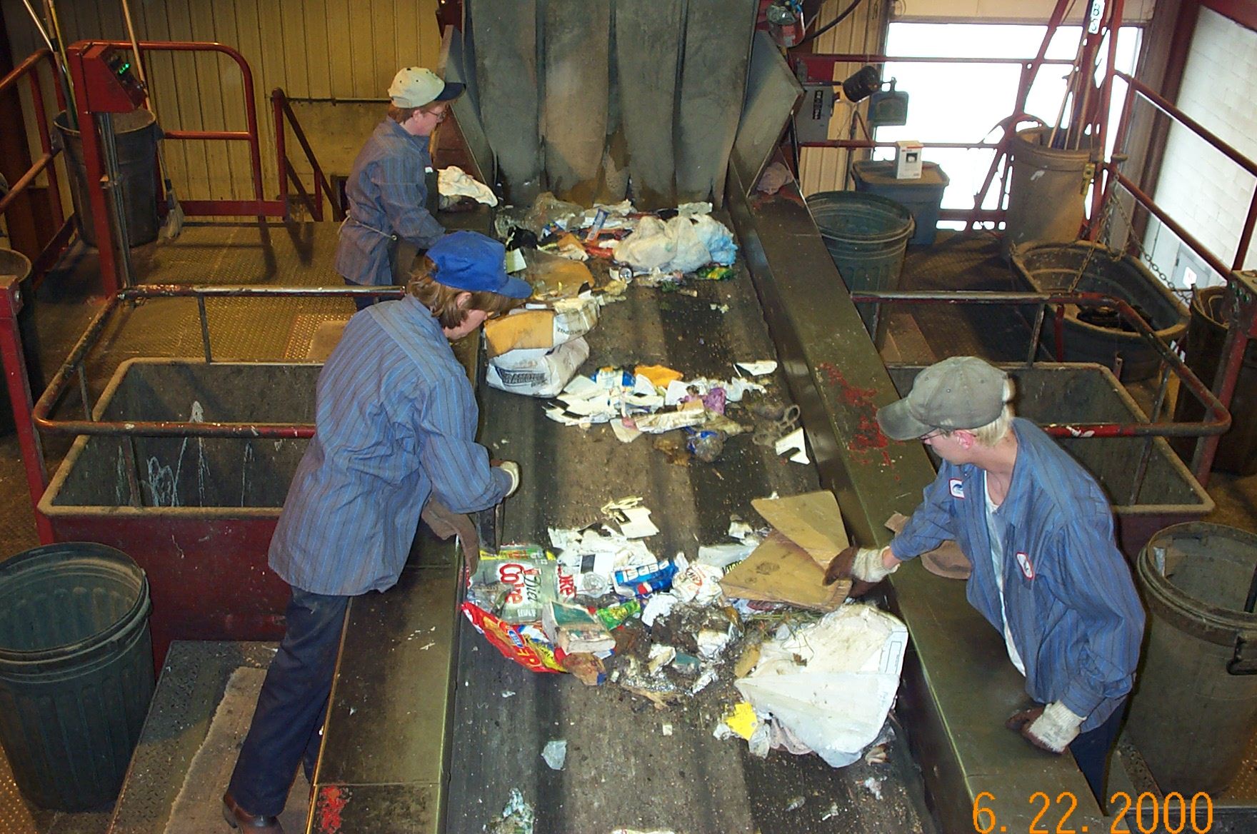 People Work the Materials Removal Pick Line