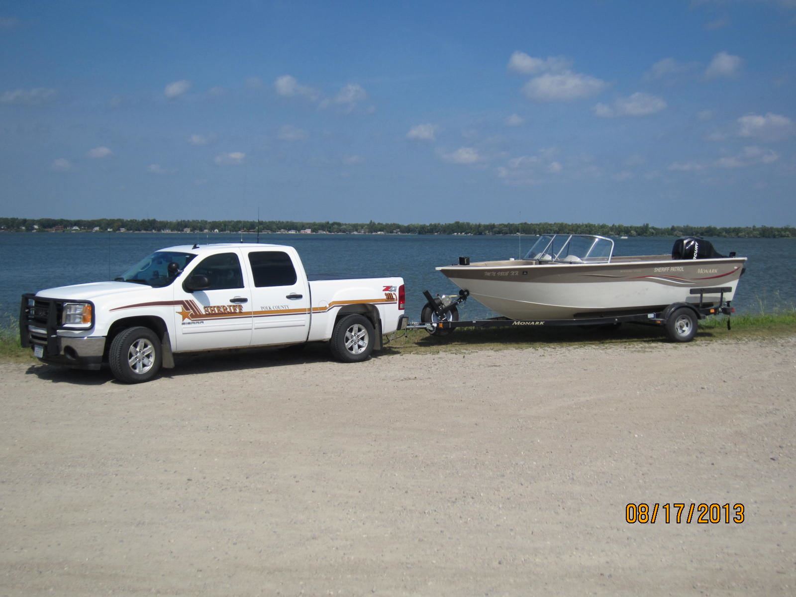 Monarch Boat pulled by Sheriff Truck